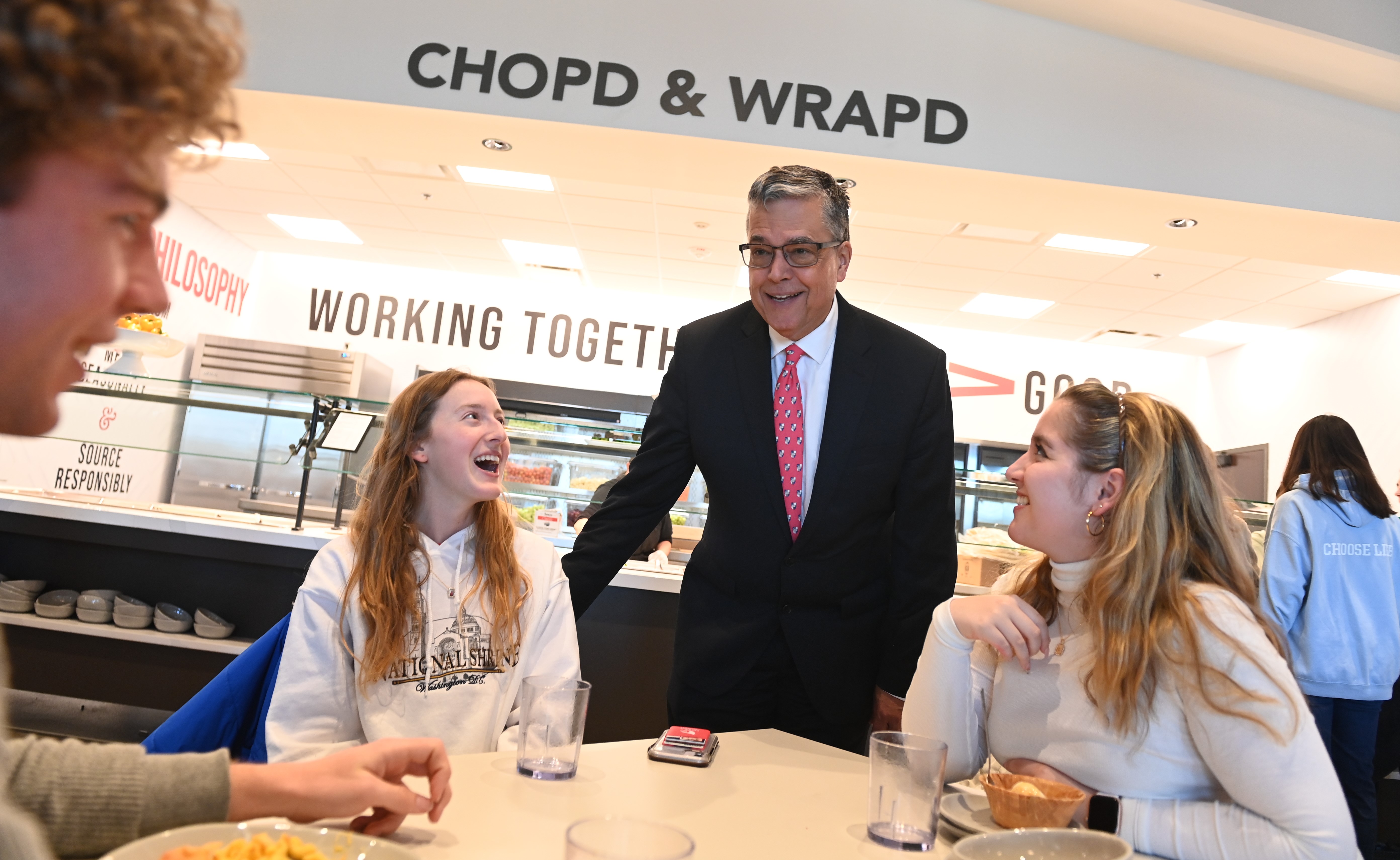 President Kilpatrick talking to students as they eat in Garvey Hall